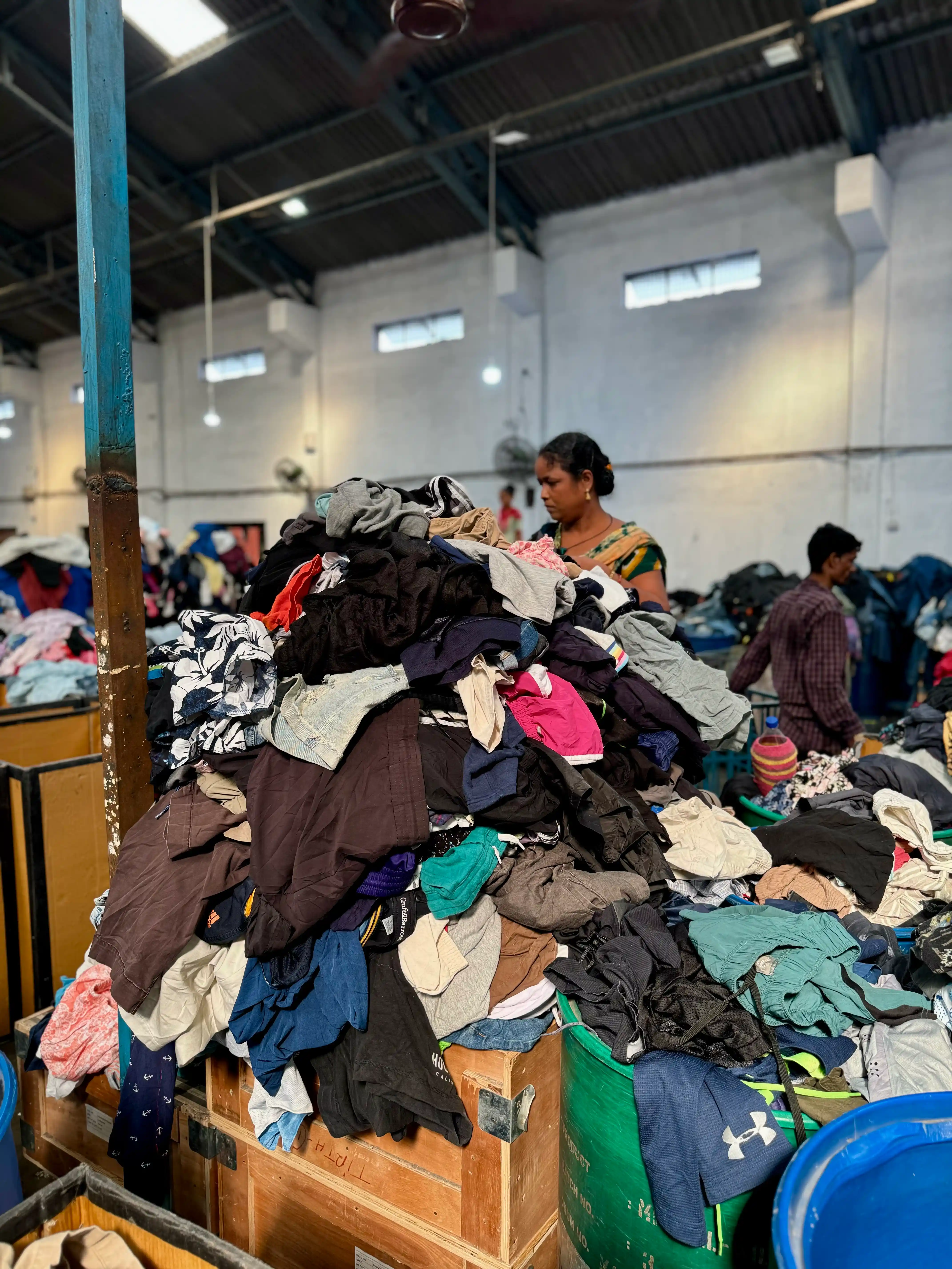 Used clothing being carefully sorted and selected